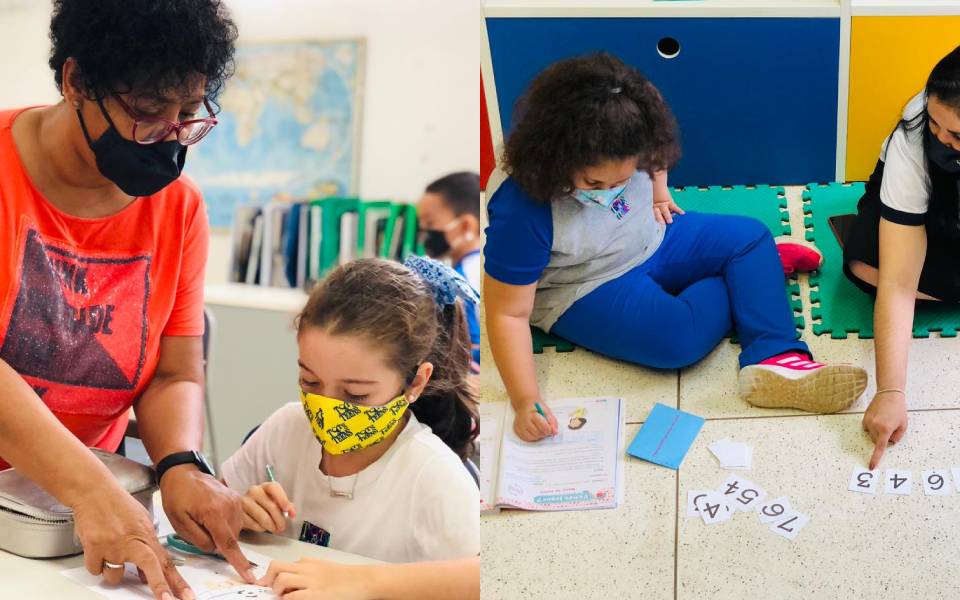 Crianças fazendo atividades dentro da sala de aula.
